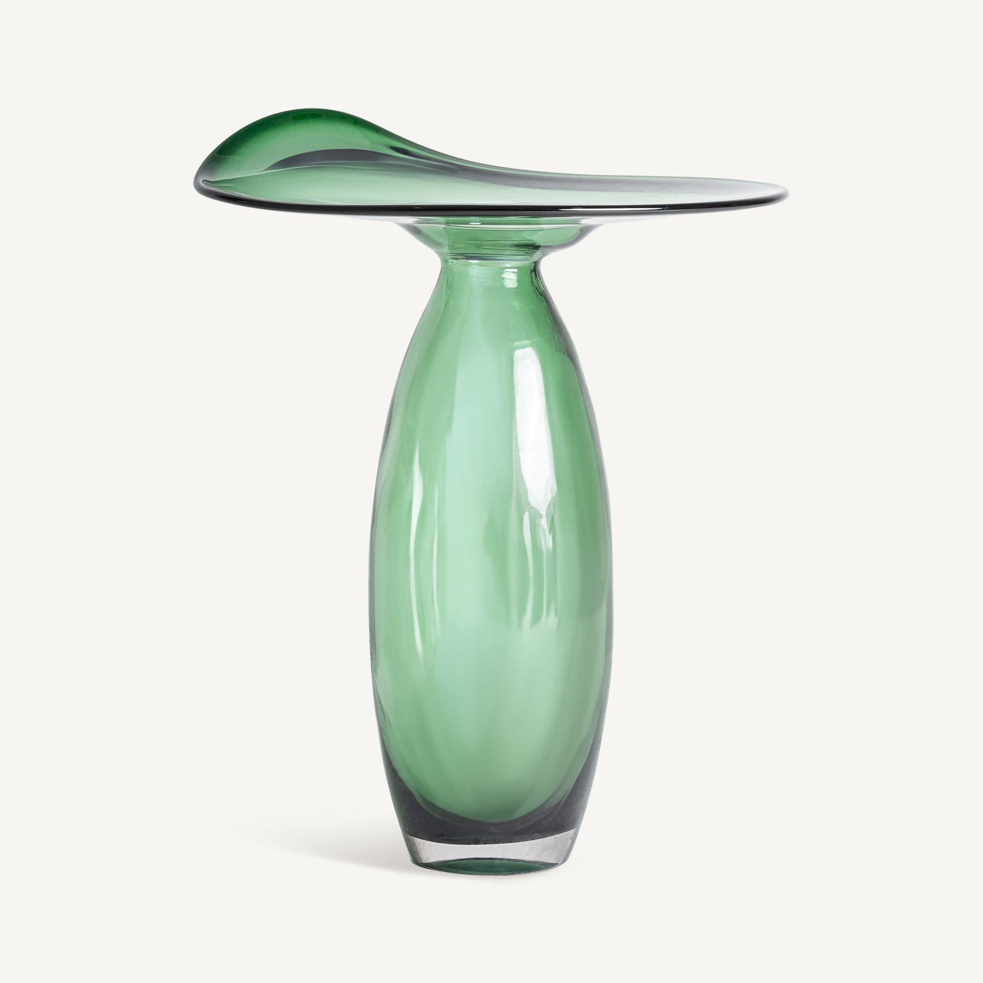 Tall translucent green glass vase with a slender body and a wide asymmetric wave-shaped rim