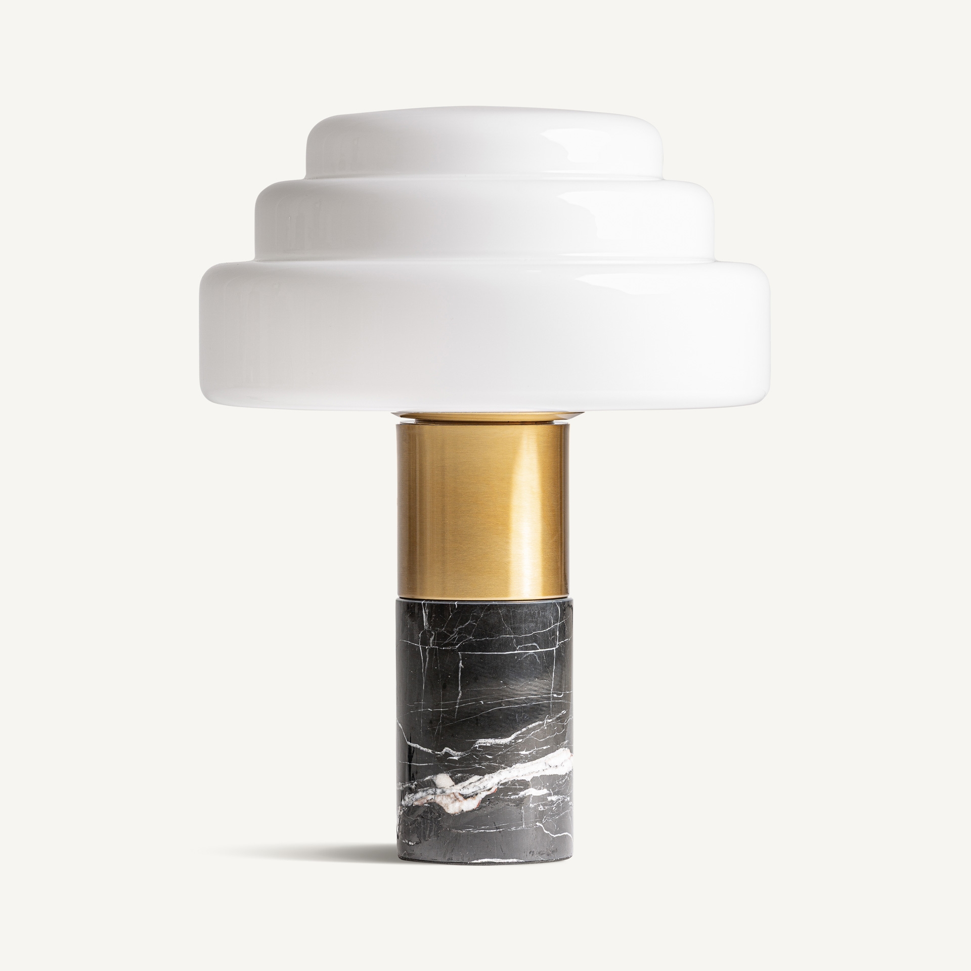 Ivory glass table lamp with a veined black marble base and gold-coloured stem