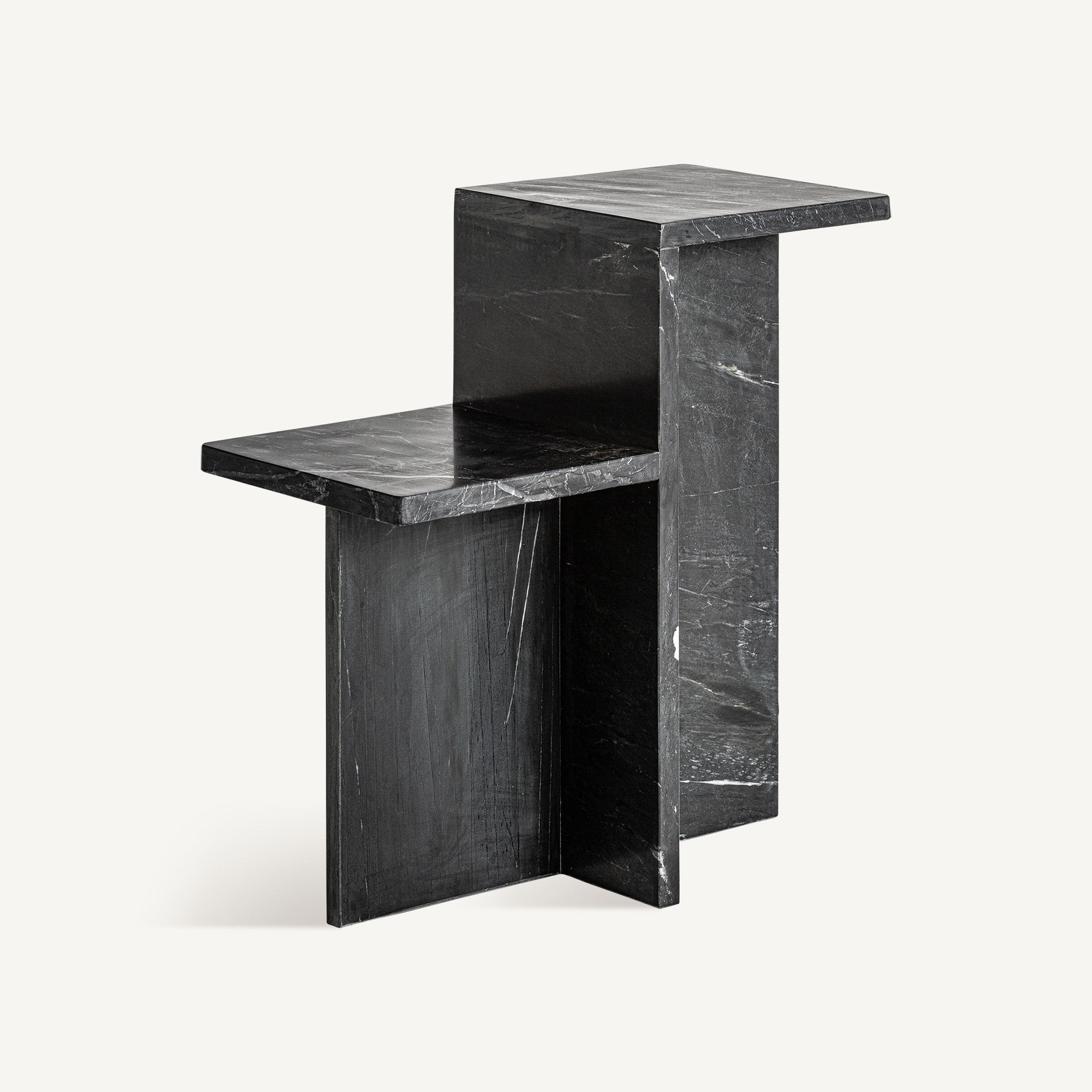 Architectural side table in matte black marble with natural veining