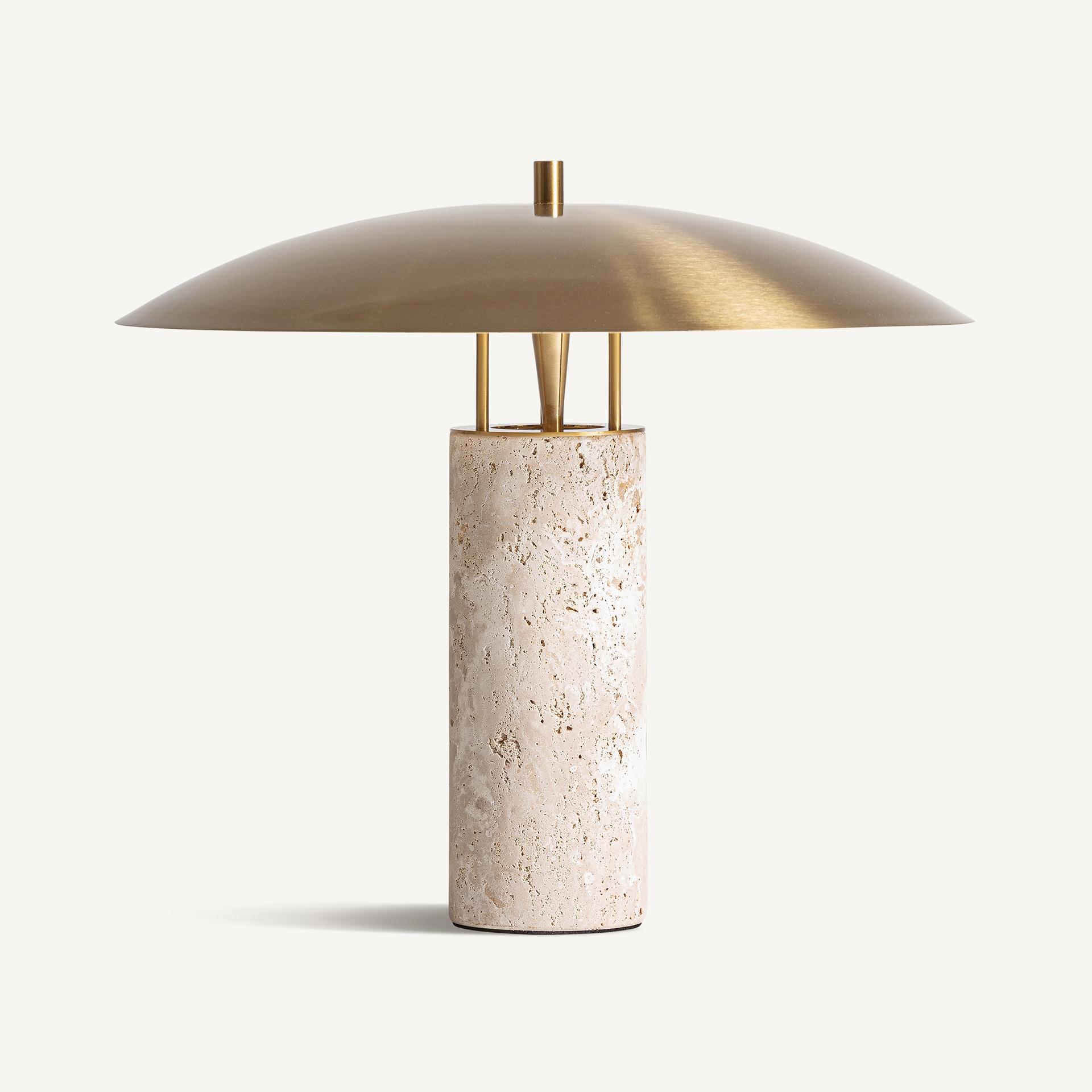 Sculptural table lamp with a beige travertine column and broad gold-coloured steel shade