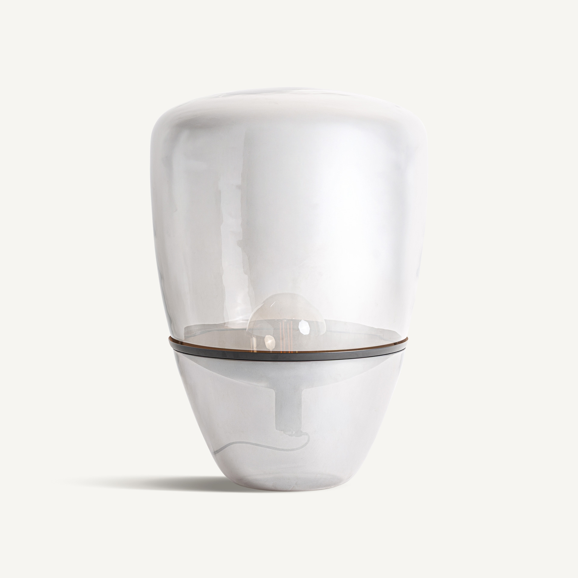 Rounded smoked-grey glass table lamp with a silver-toned metal band
